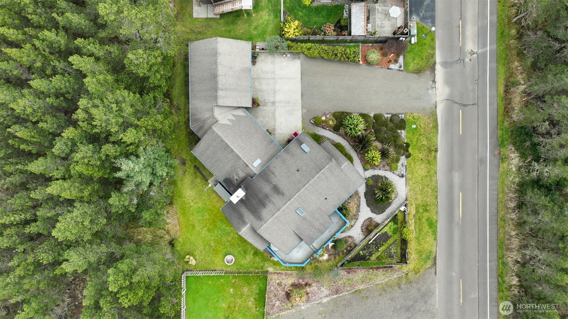 402 17th Street Southwest Long Beach, WA 98631 - Photo 28 of 32 an aerial view of a house with a yard and swimming pool