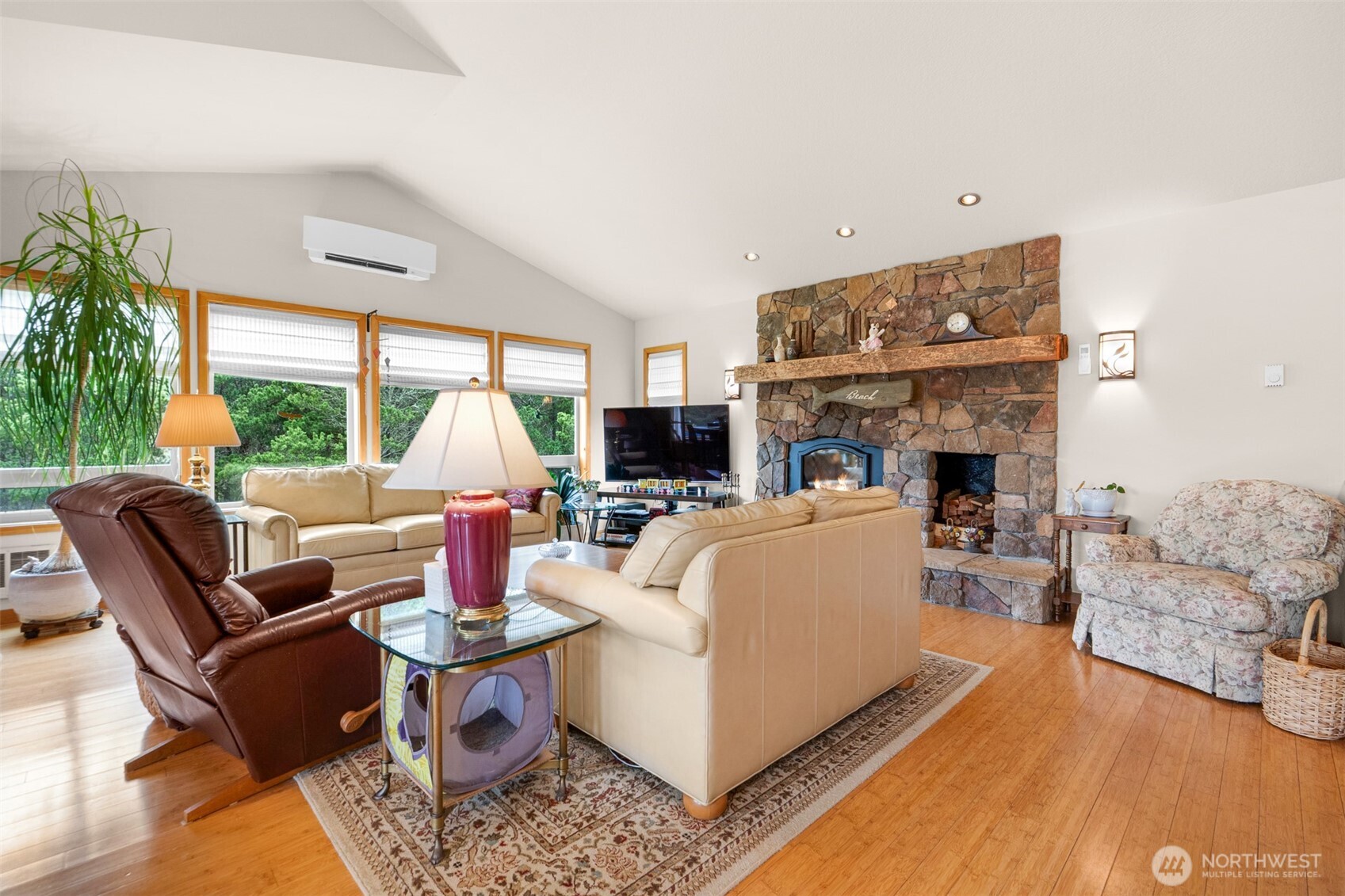 402 17th Street Southwest Long Beach, WA 98631 - Photo 10 of 32 a living room with furniture fireplace and a large window