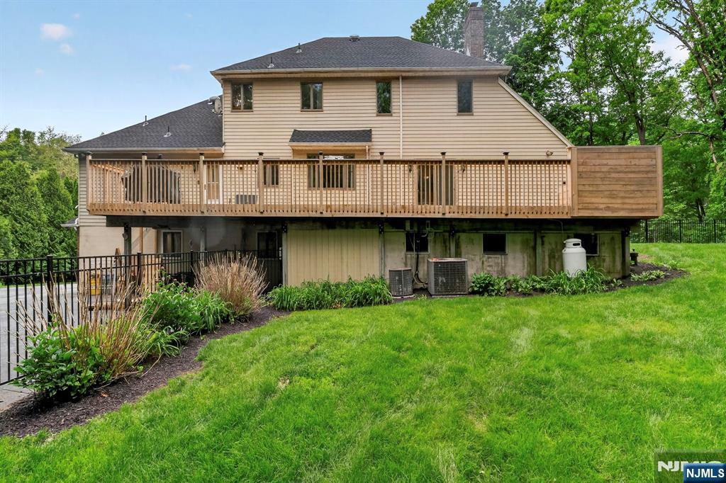 5110 Berkshire Valley Road Oak Ridge, NJ 07438 - Photo 45 of 49 a view of a house with a yard balcony and chairs