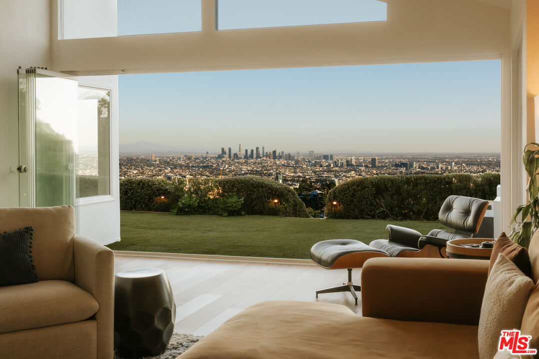 a view of a garden with furniture