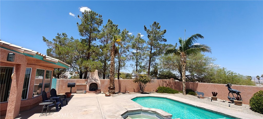 6144 Carodean Road Twentynine Palms, CA 92277 - Photo 15 of 71 a view of a house with backyard porch and sitting area