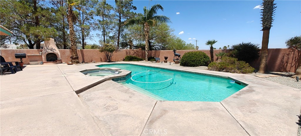 6144 Carodean Road Twentynine Palms, CA 92277 - Photo 20 of 71 a view of a swimming pool with a backyard