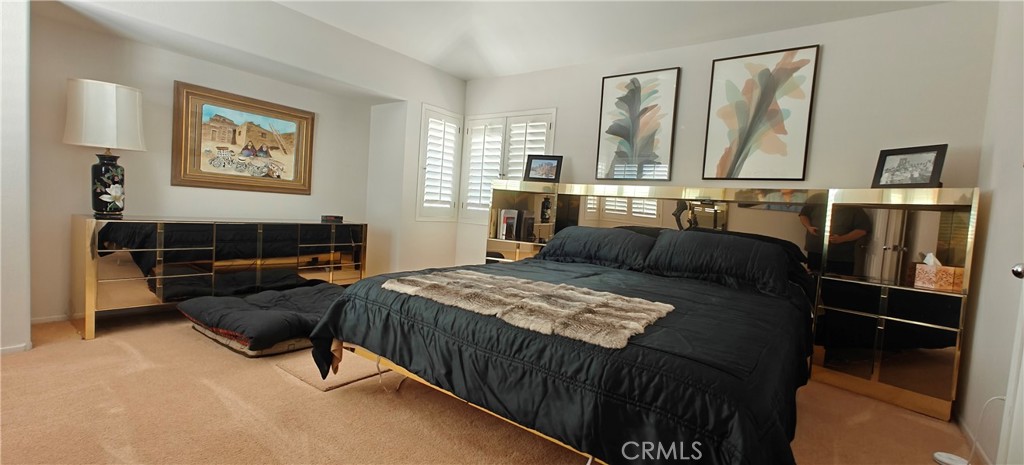 6144 Carodean Road Twentynine Palms, CA 92277 - Photo 28 of 71 a bed room with a bed and a television