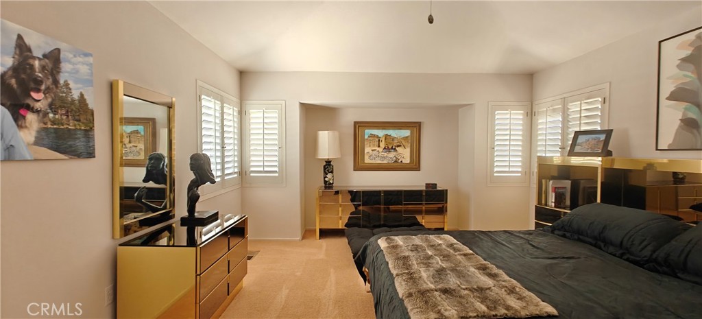 6144 Carodean Road Twentynine Palms, CA 92277 - Photo 29 of 71 a bedroom with furniture and a flat screen tv