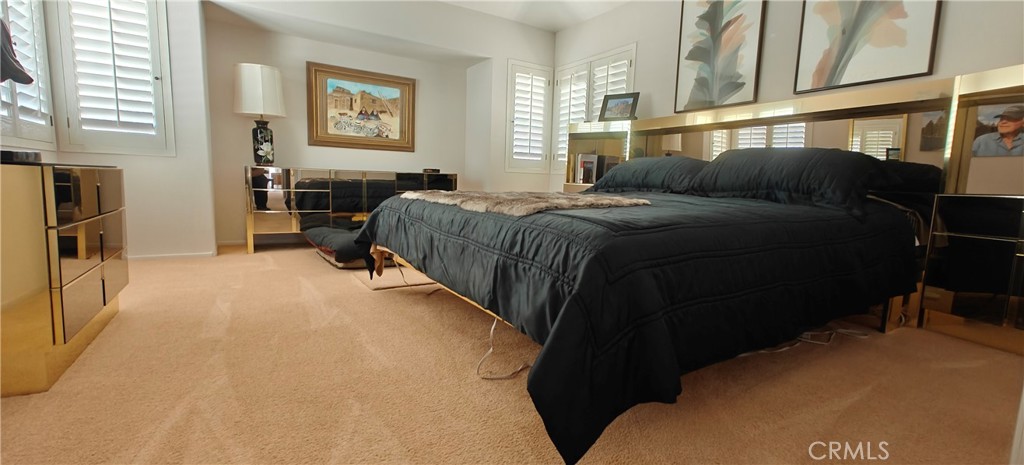 6144 Carodean Road Twentynine Palms, CA 92277 - Photo 30 of 71 a bedroom with a bed next to a window