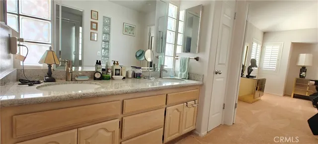 a kitchen with stainless steel appliances a refrigerator sink and cabinets