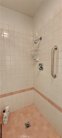 a kitchen with stainless steel appliances kitchen island a refrigerator sink and stove