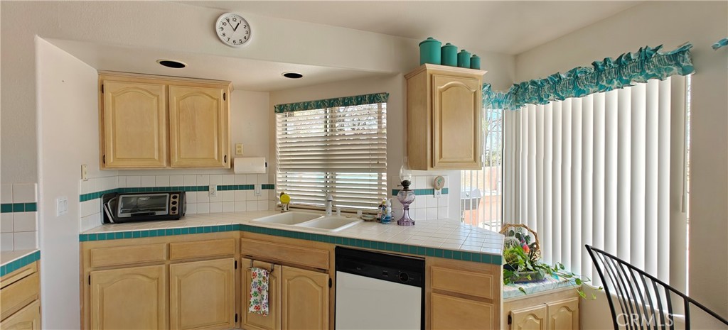 6144 Carodean Road Twentynine Palms, CA 92277 - Photo 49 of 71 a kitchen with a sink cabinets and window
