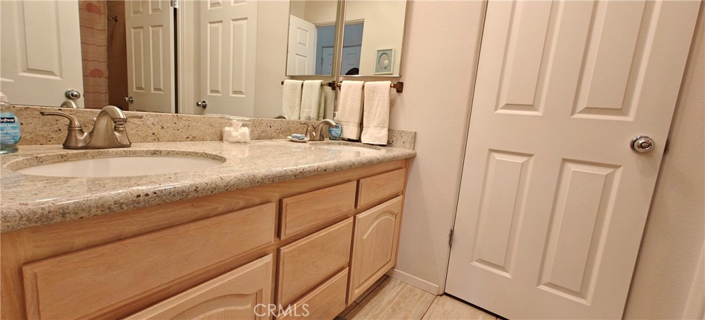 6144 Carodean Road Twentynine Palms, CA 92277 - Photo 60 of 71 a bathroom with a granite countertop sink and a mirror