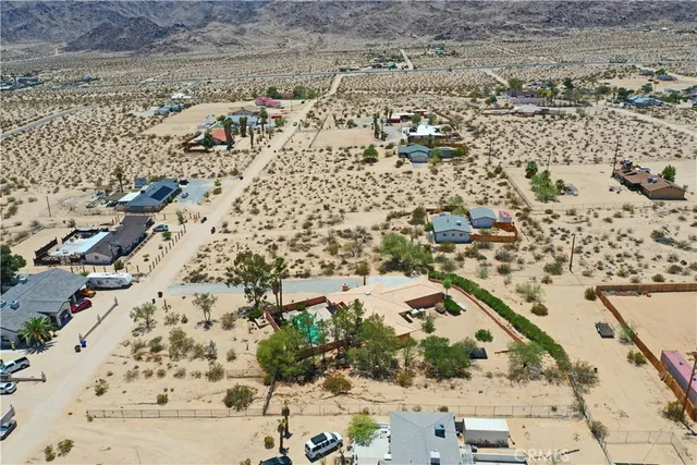 a view of a chair and tables in patio of the house