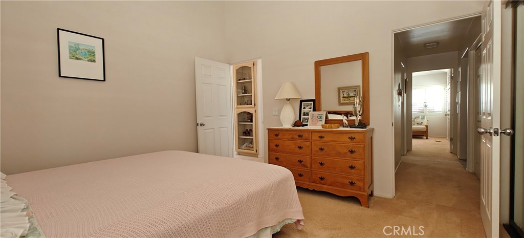 6144 Carodean Road Twentynine Palms, CA 92277 - Photo 63 of 71 a bedroom with a bed and walk in closet