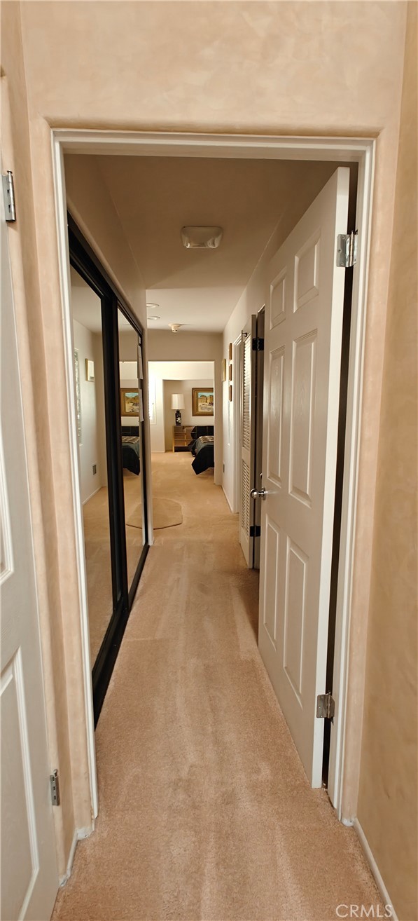 6144 Carodean Road Twentynine Palms, CA 92277 - Photo 64 of 71 a view of a hallway with wooden floor and staircase
