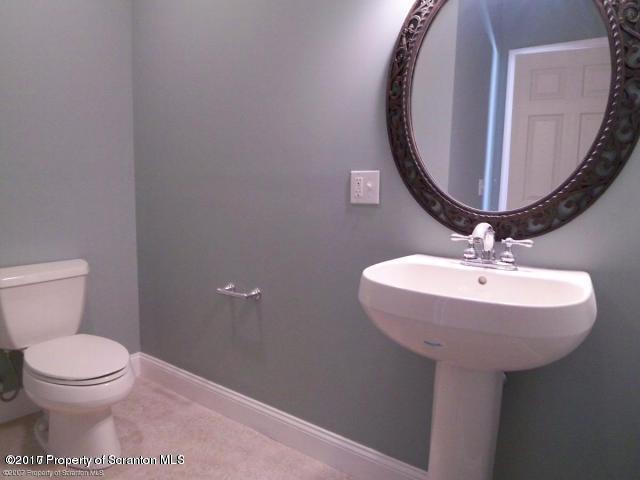 705 Green Ridge Street Scranton, PA 18509 - Photo 12 of 14 a bathroom with a sink and a mirror