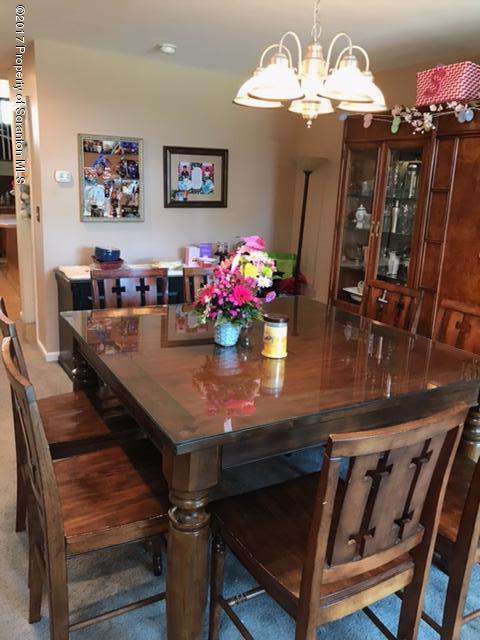 705 Green Ridge Street Scranton, PA 18509 - Photo 13 of 14 a view of a dining room with furniture and chandelier