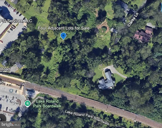 a backyard of a house with lots of plants and flowers