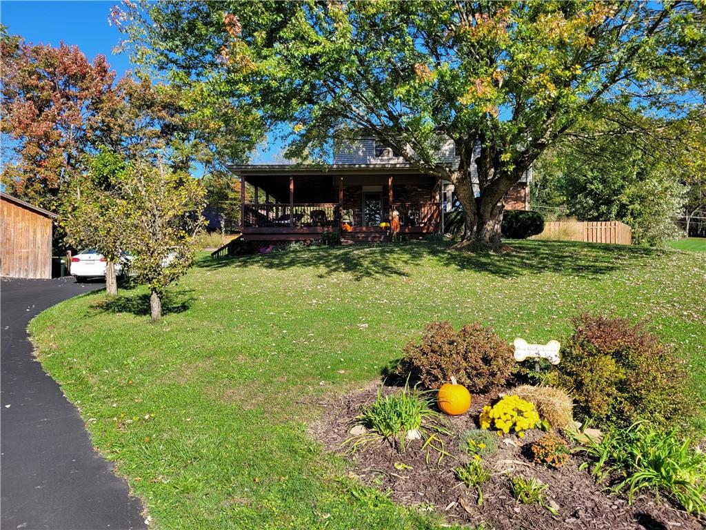 117 Thompson Road Sarver, PA 16055 - Photo 1 of 25 a front view of a house with garden