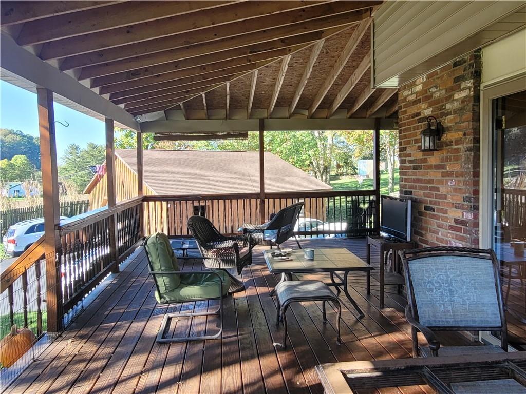 117 Thompson Road Sarver, PA 16055 - Photo 13 of 25 a view of a chairs and table in patio with wooden floor