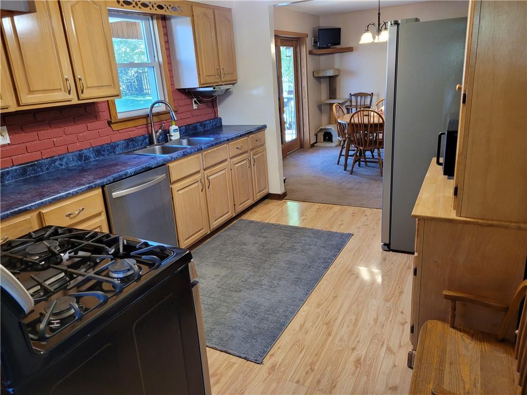 117 Thompson Road Sarver, PA 16055 - Photo 18 of 25 a kitchen with stainless steel appliances granite countertop a stove and a sink
