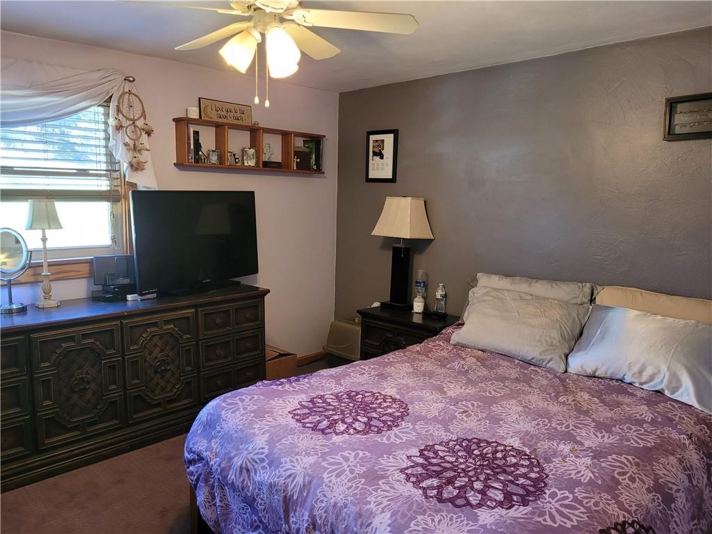 117 Thompson Road Sarver, PA 16055 - Photo 23 of 25 a bedroom with a bed and a flat screen tv
