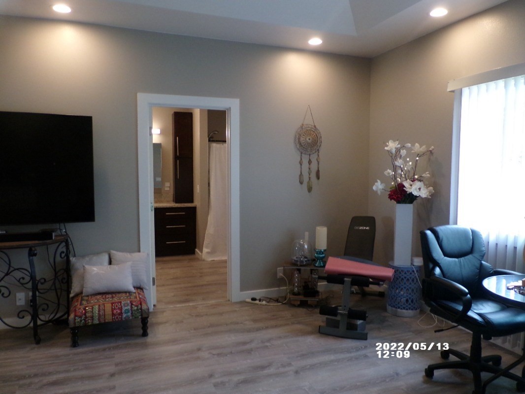 18-4177 North Peck Road Mountain View, HI 96771 - Photo 14 of 24 a living room with furniture and a flat screen tv