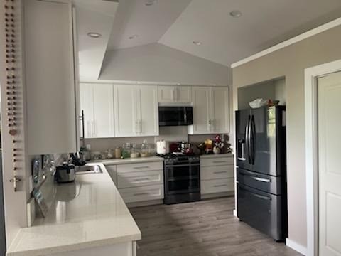18-4177 North Peck Road Mountain View, HI 96771 - Photo 5 of 24 a kitchen with a refrigerator stove and sink