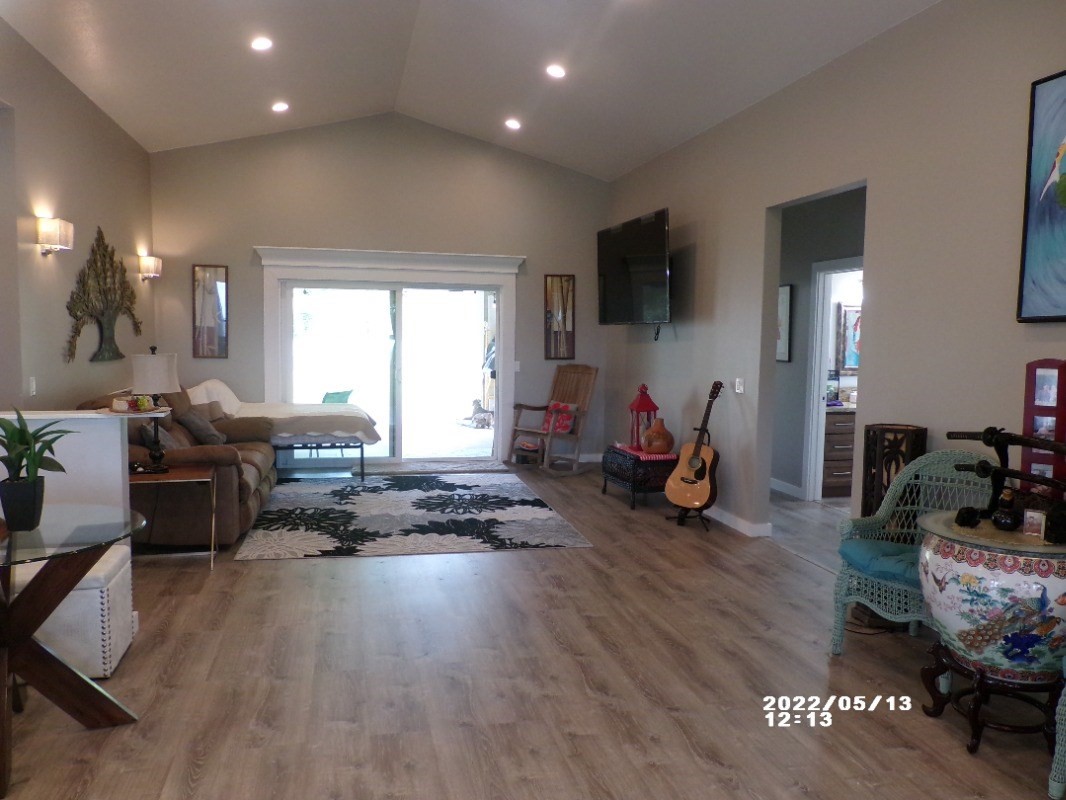 18-4177 North Peck Road Mountain View, HI 96771 - Photo 9 of 24 a living room filled with furniture window and a flat screen tv