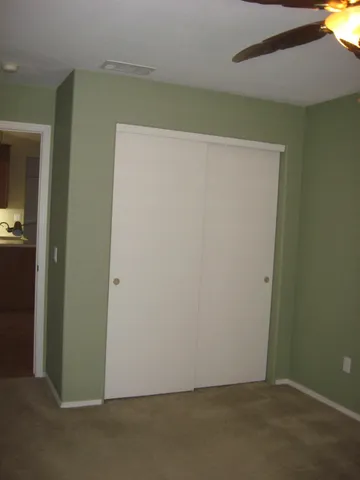 an empty room with wooden floor