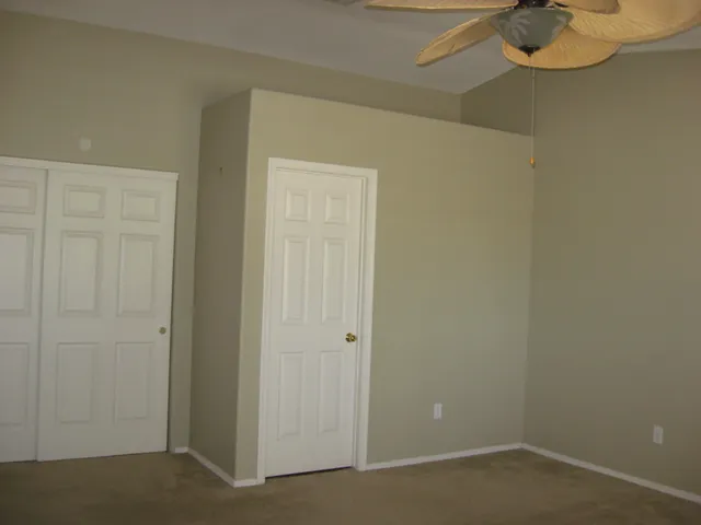 a bathroom with a granite countertop toilet sink and shower