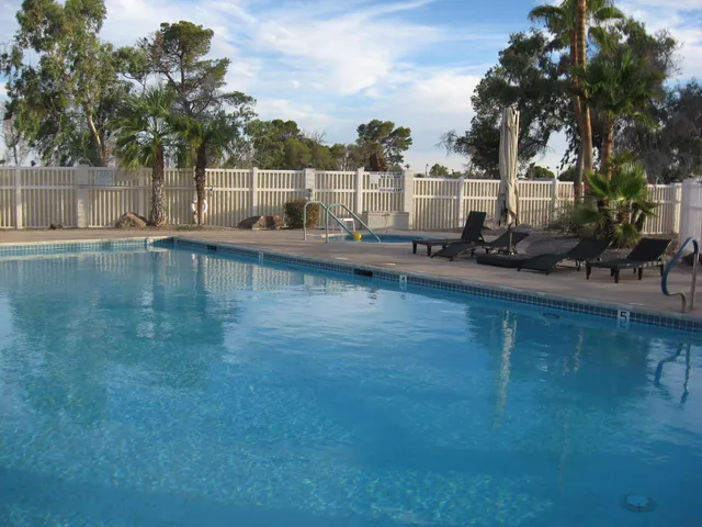 a view of a living room and bedroom
