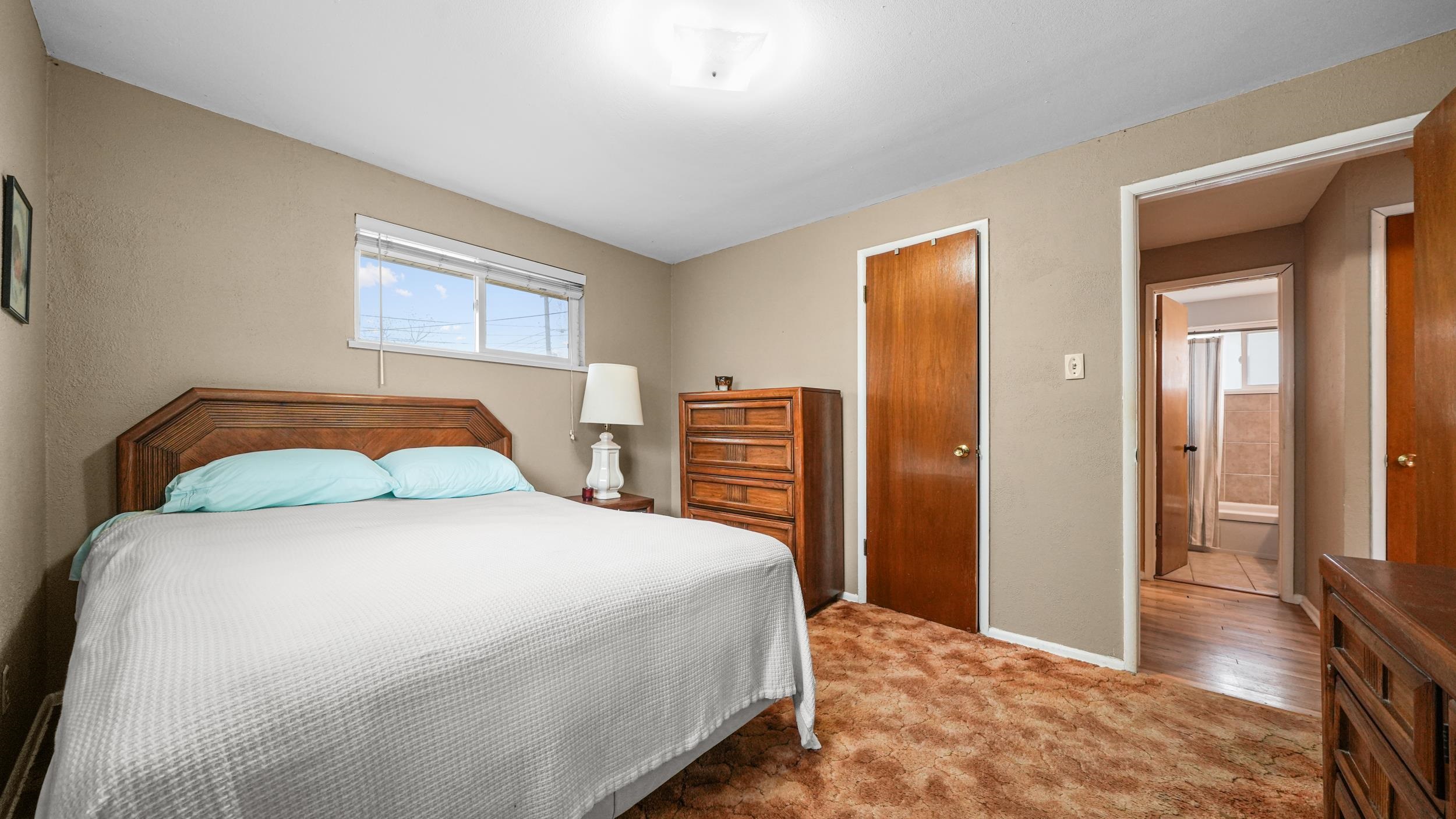 404 North 25th Street Grand Junction, CO 81501 - Photo 13 of 21 a bedroom with a bed and a dresser with rug