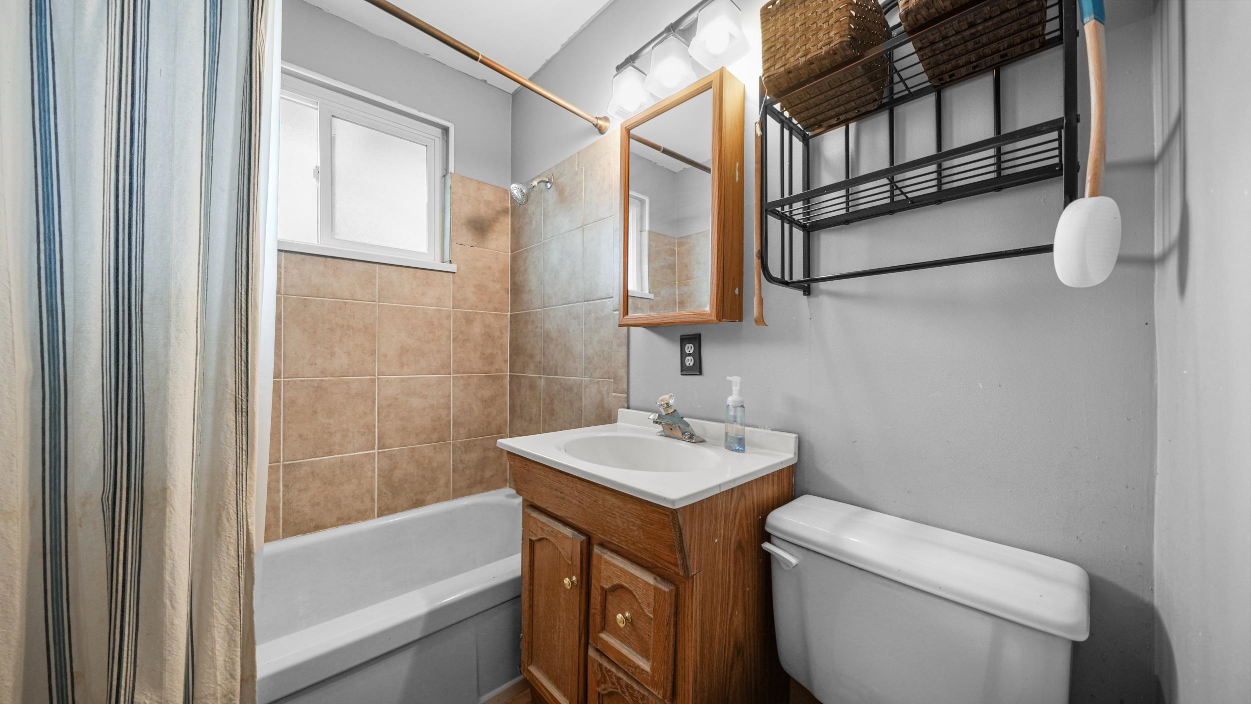 404 North 25th Street Grand Junction, CO 81501 - Photo 14 of 21 a bathroom with a sink a toilet and shower