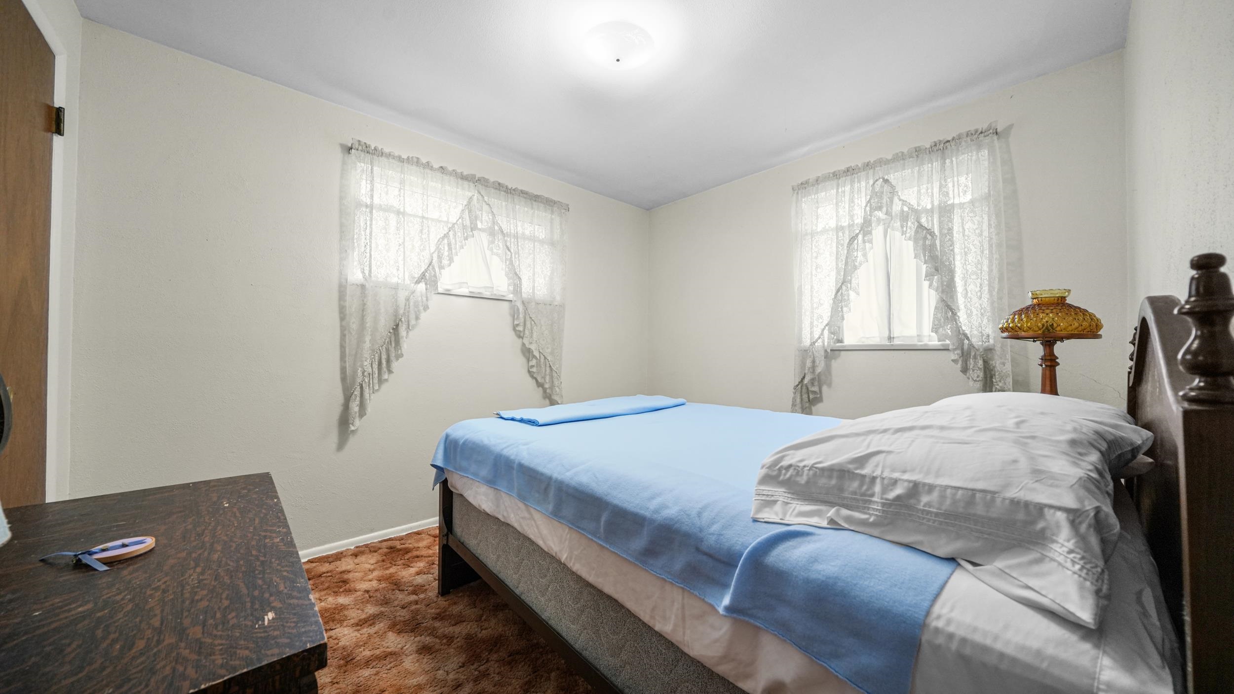 404 North 25th Street Grand Junction, CO 81501 - Photo 15 of 21 a bedroom with a bed and window