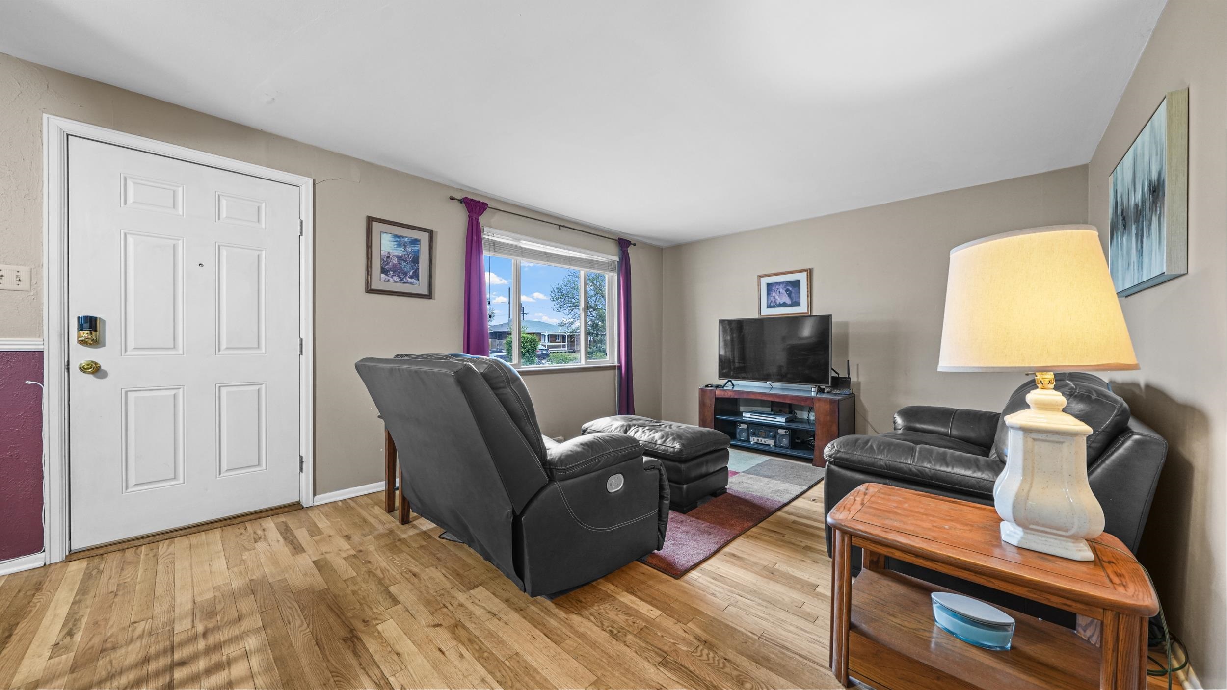 404 North 25th Street Grand Junction, CO 81501 - Photo 5 of 21 a living room with furniture and a flat screen tv