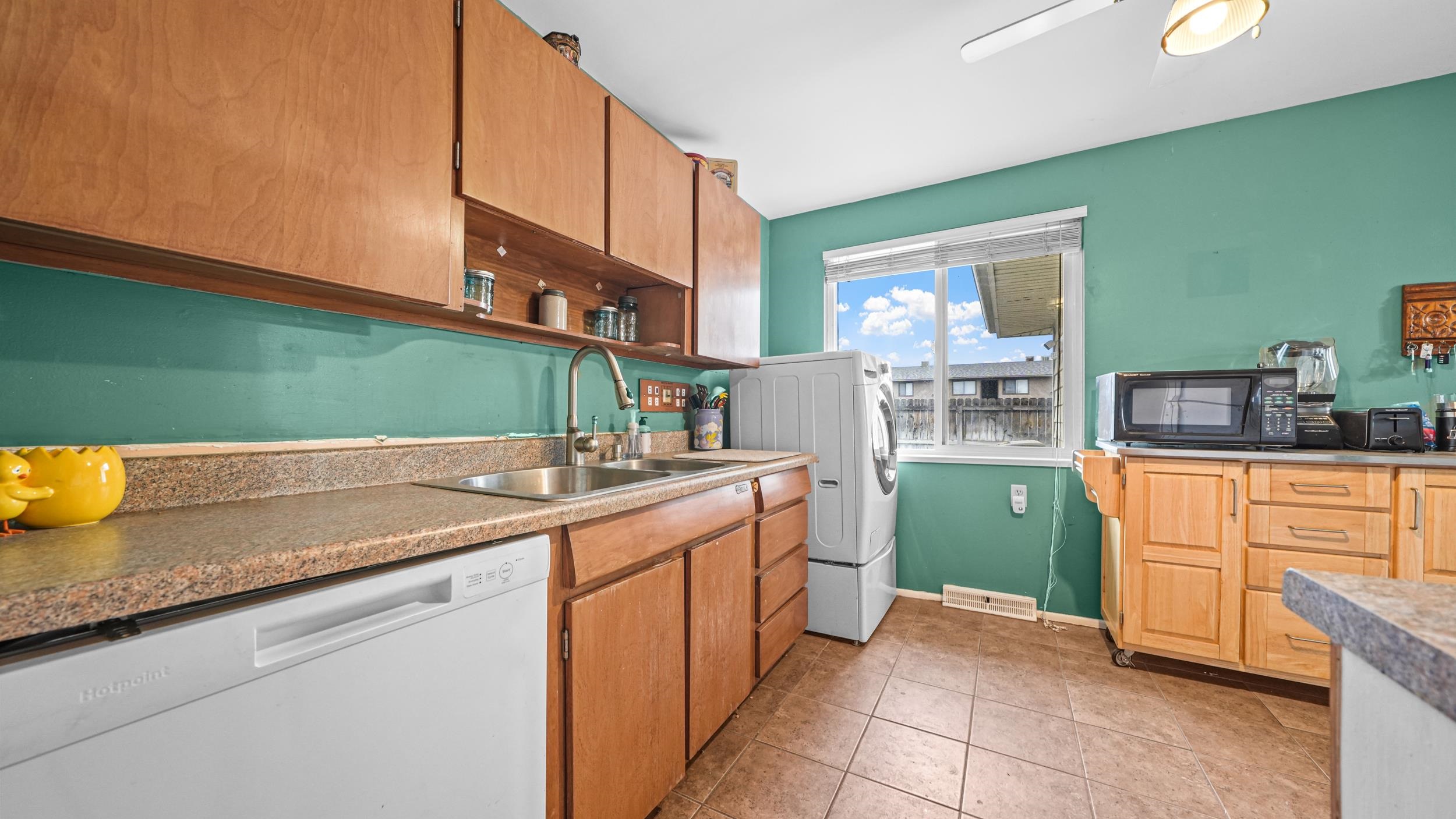 404 North 25th Street Grand Junction, CO 81501 - Photo 8 of 21 a kitchen with stainless steel appliances granite countertop a sink and a cabinets