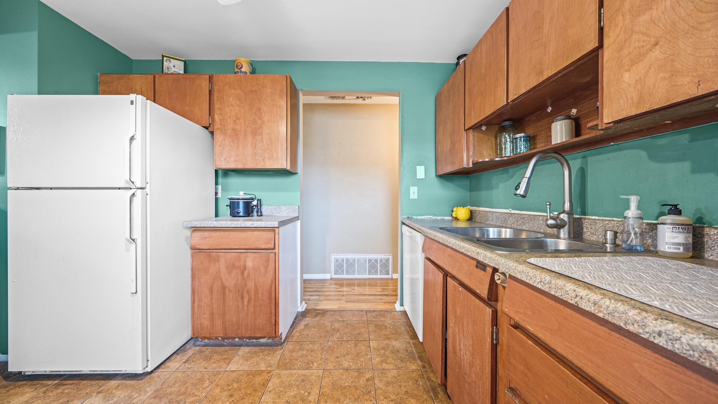 404 North 25th Street Grand Junction, CO 81501 - Photo 9 of 21 a kitchen with stainless steel appliances a refrigerator and a sink