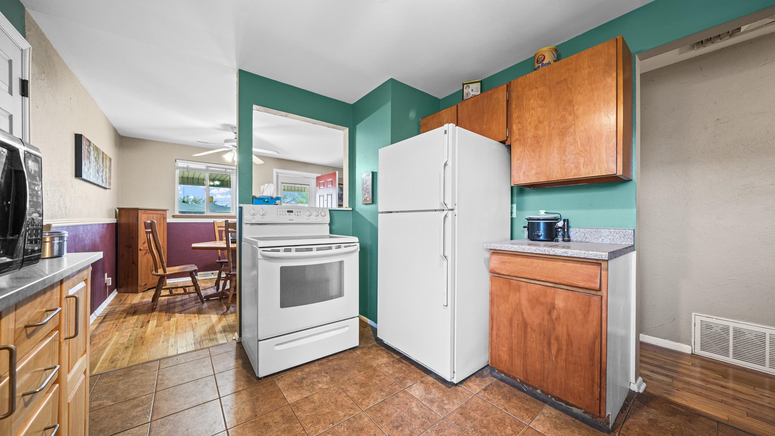 404 North 25th Street Grand Junction, CO 81501 - Photo 10 of 21 a kitchen with stainless steel appliances a refrigerator sink and cabinets