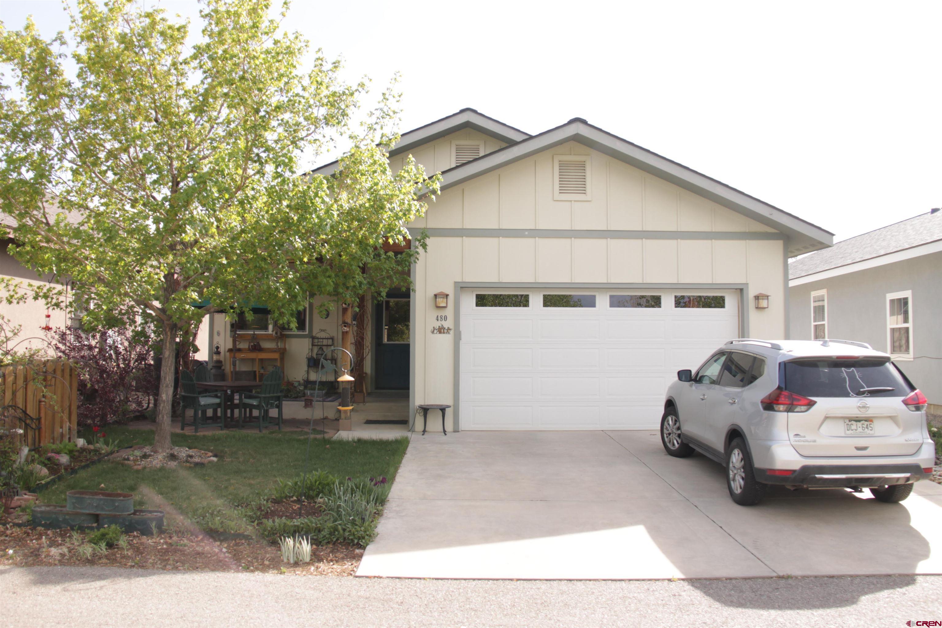 480 Oxbow Circle Durango, CO 81301 - Photo 2 of 16 a car parked in front of white house