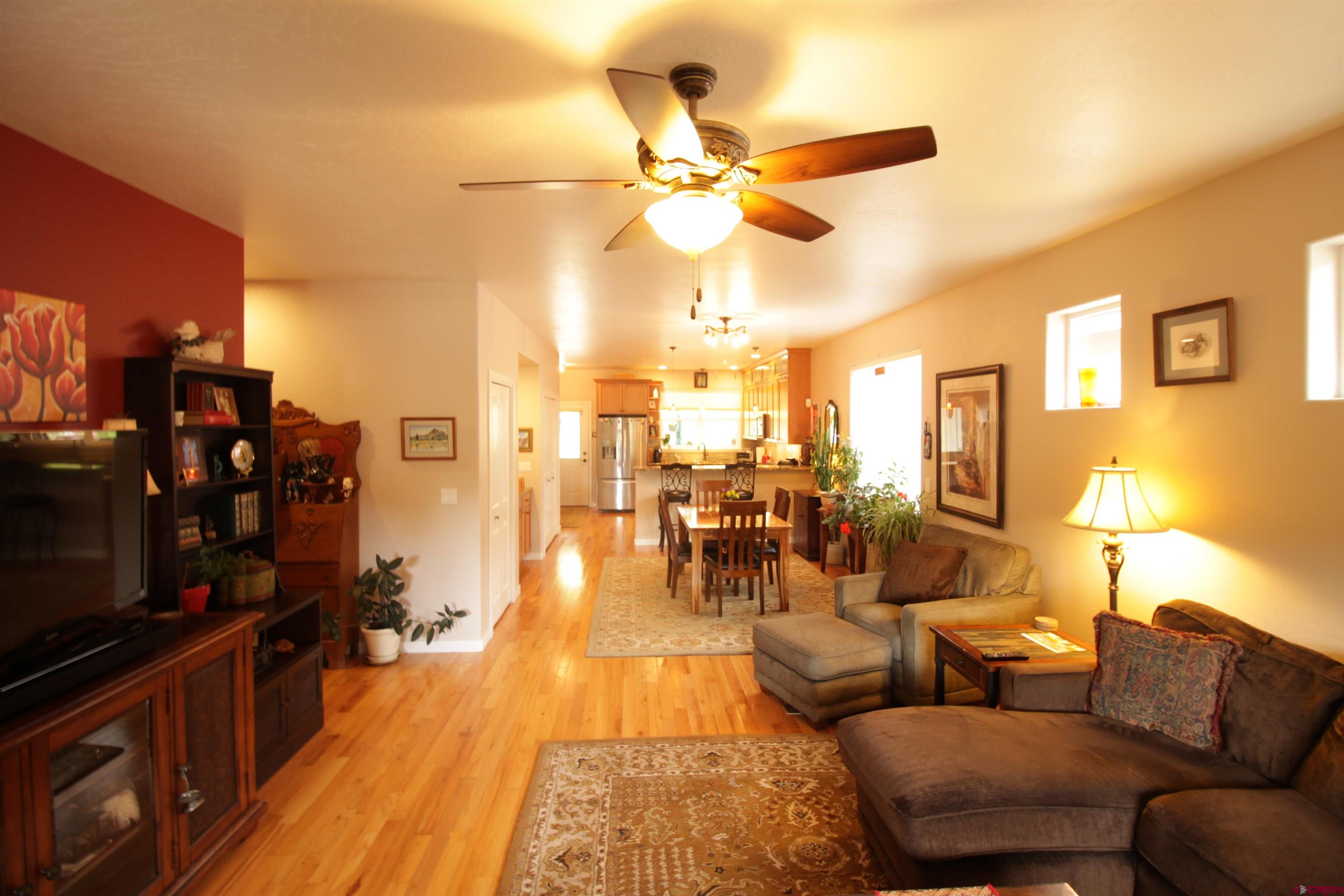 480 Oxbow Circle Durango, CO 81301 - Photo 9 of 16 a living room with furniture and a flat screen tv