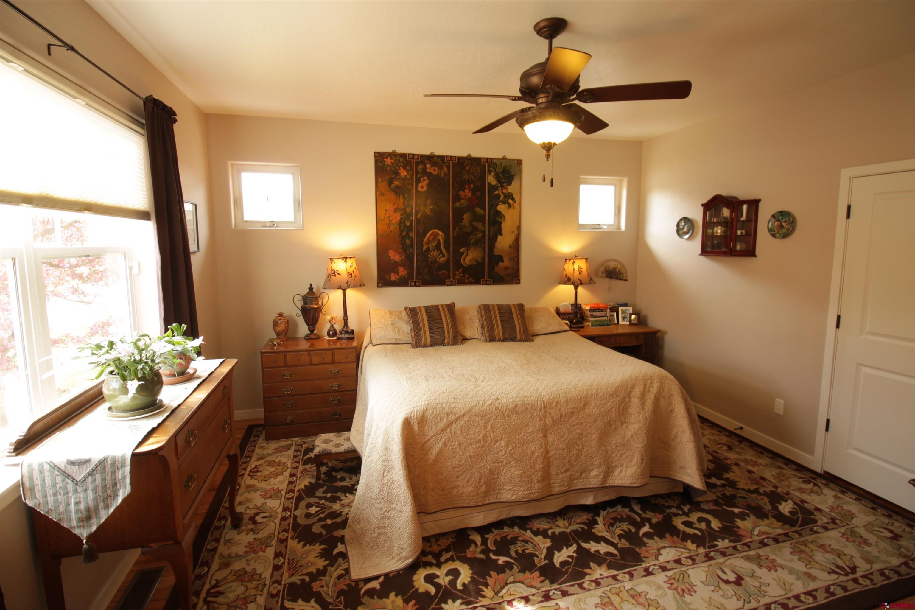 480 Oxbow Circle Durango, CO 81301 - Photo 10 of 16 a bedroom with a bed dresser and window