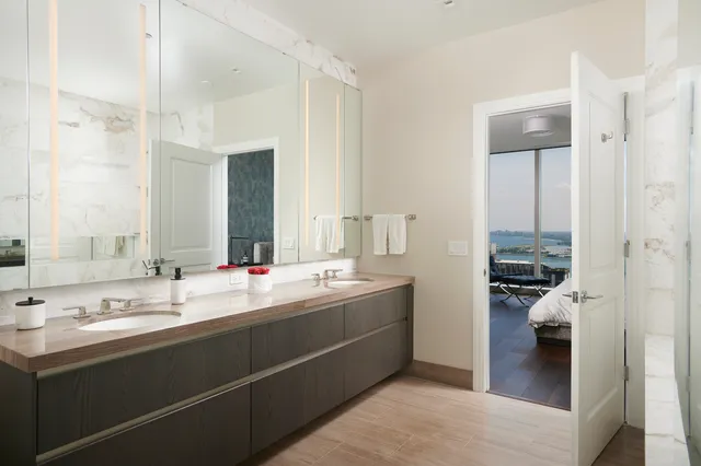 a bathroom with a bathtub and a shower