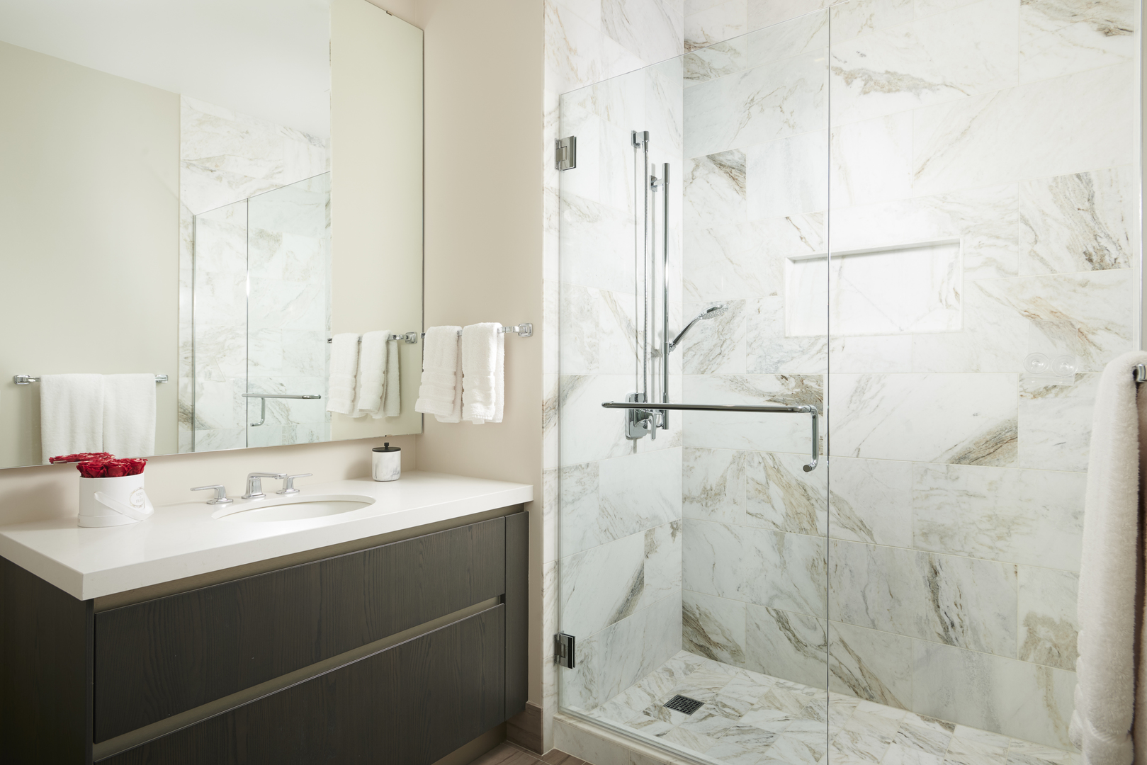 363 East Wacker Drive, Unit 3303 Chicago, IL 60601 - Photo 19 of 31 a bathroom with a sink shower and a mirror