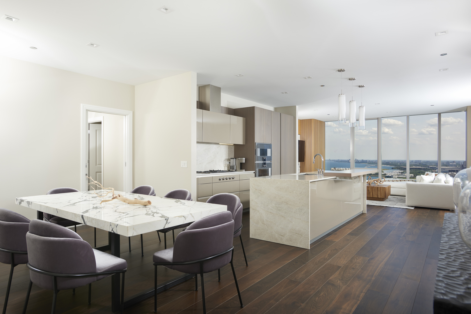 363 East Wacker Drive, Unit 3303 Chicago, IL 60601 - Photo 2 of 31 a large white kitchen with a table and chairs