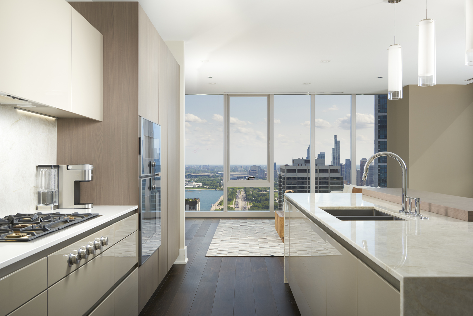 363 East Wacker Drive, Unit 3303 Chicago, IL 60601 - Photo 3 of 31 a kitchen with a large window and a sink