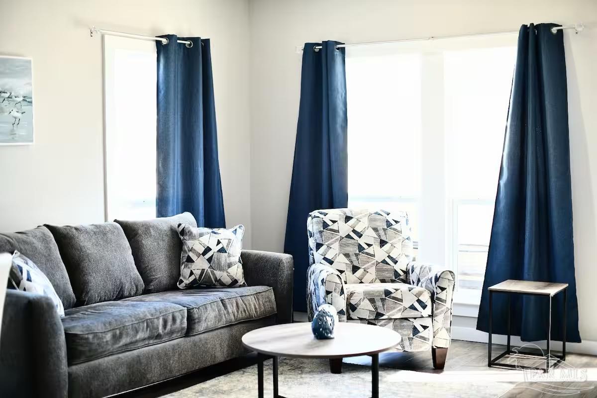 5446 Medina Road Pensacola, FL 32507 - Photo 2 of 11 a living room with furniture and a large window