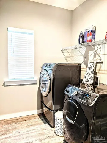 a view of storage and utility room with washer and dryer