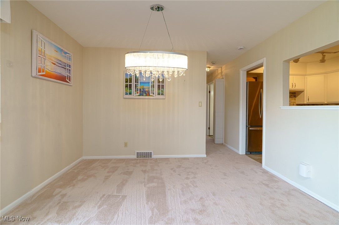 2089 Wooster Road, Unit C42 Rocky River, OH 44116 - Photo 8 of 43 Pretty crystal chandelier and neutral paint colors