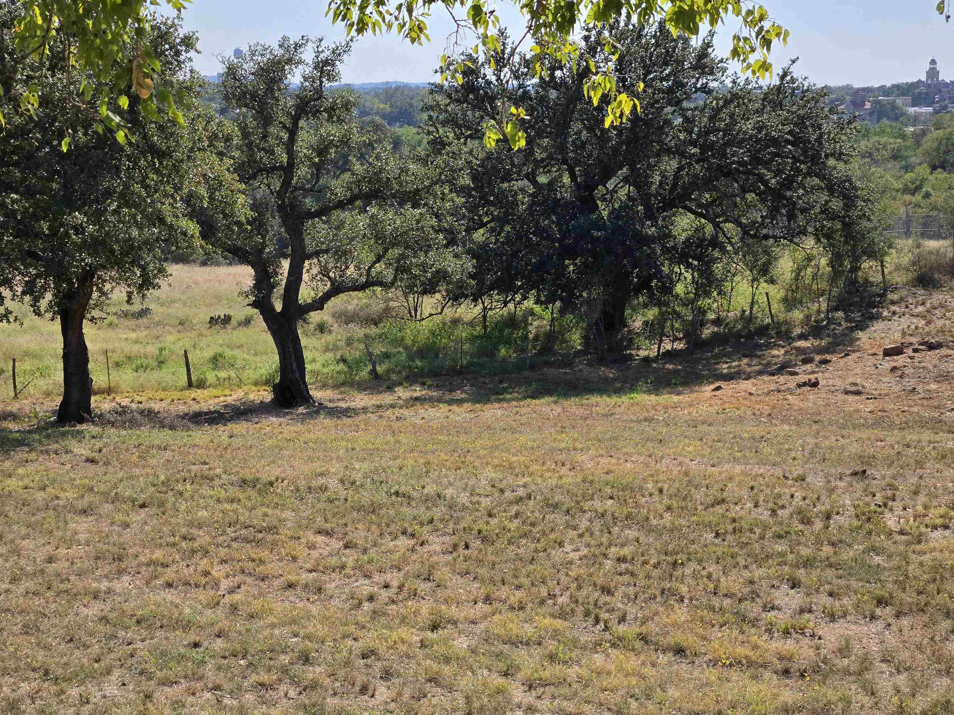 East Tarrant Street Llano, TX 78643 - Photo 12 of 19 a view of backyard of house with green space