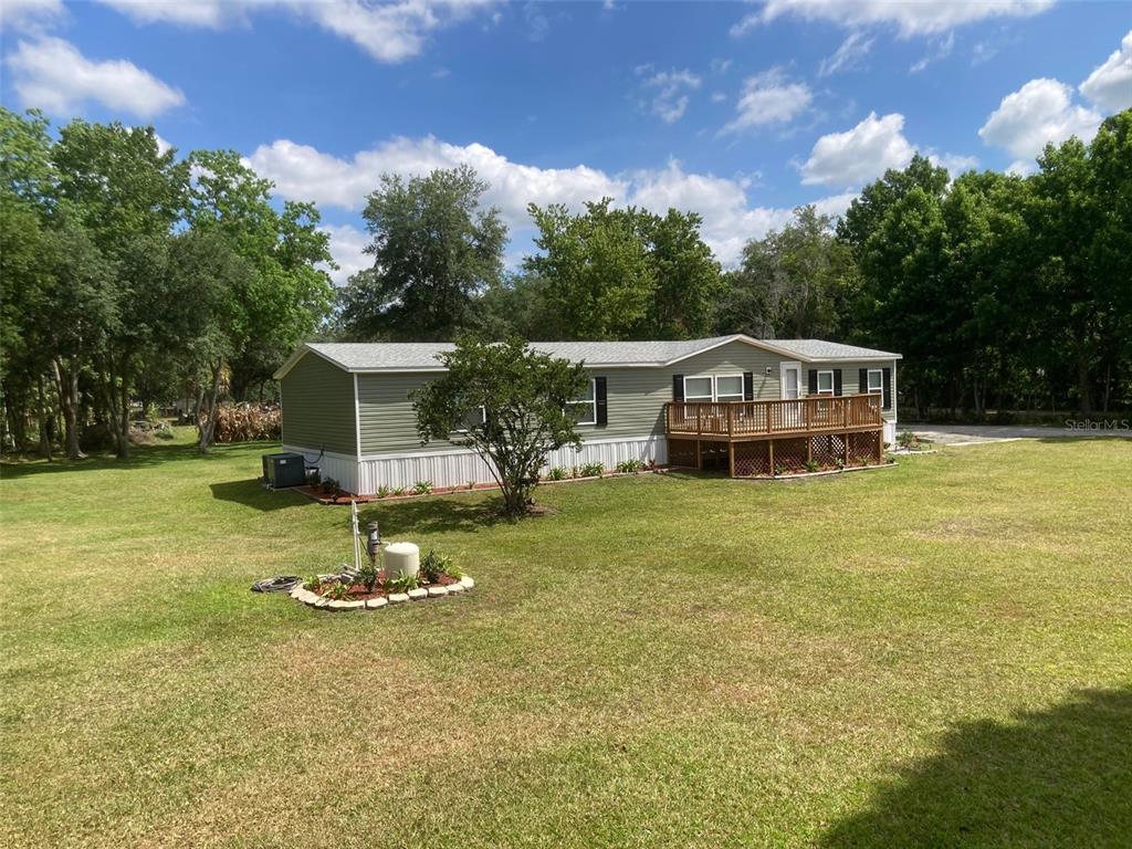 18137 Hollister Road Orlando, FL 32820 - Photo 23 of 27 a view of a house with a swimming pool