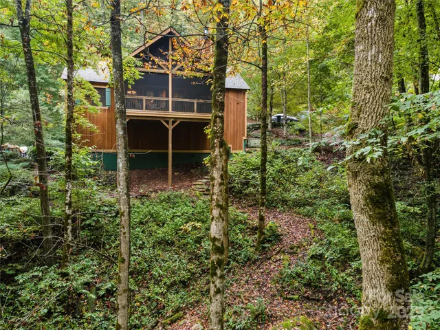 a backyard of a house with lots of green space and garden view
