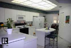 700 Starkey Road, Unit 223 Largo, FL 33771 - Photo 2 of 9 a kitchen with a table and chairs in it